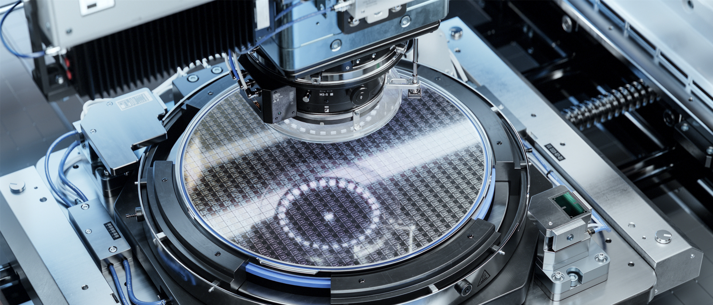 Photolithography process inside a complex computer chip production machine.