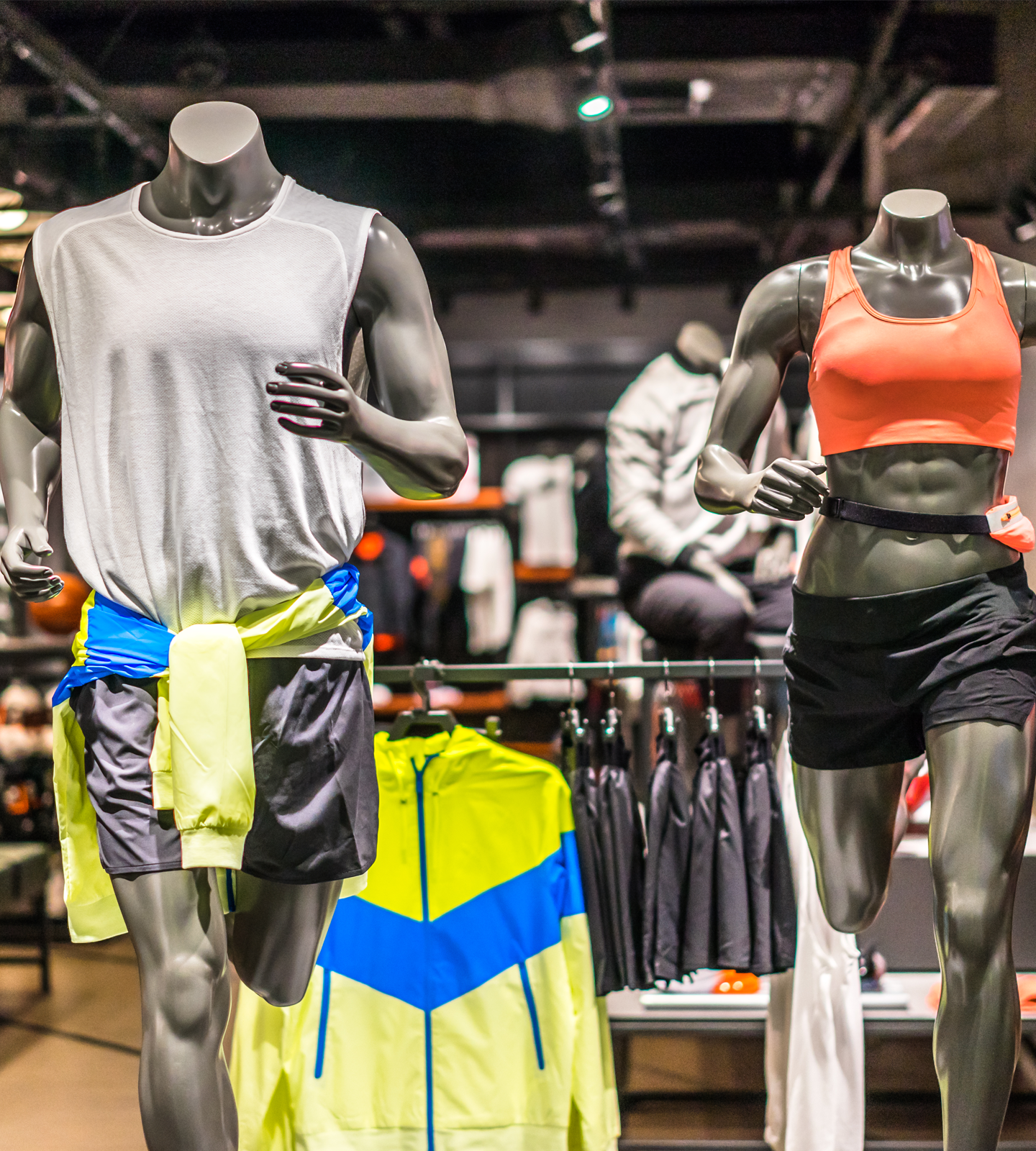 Store mannequins in sports wear at a retail store.