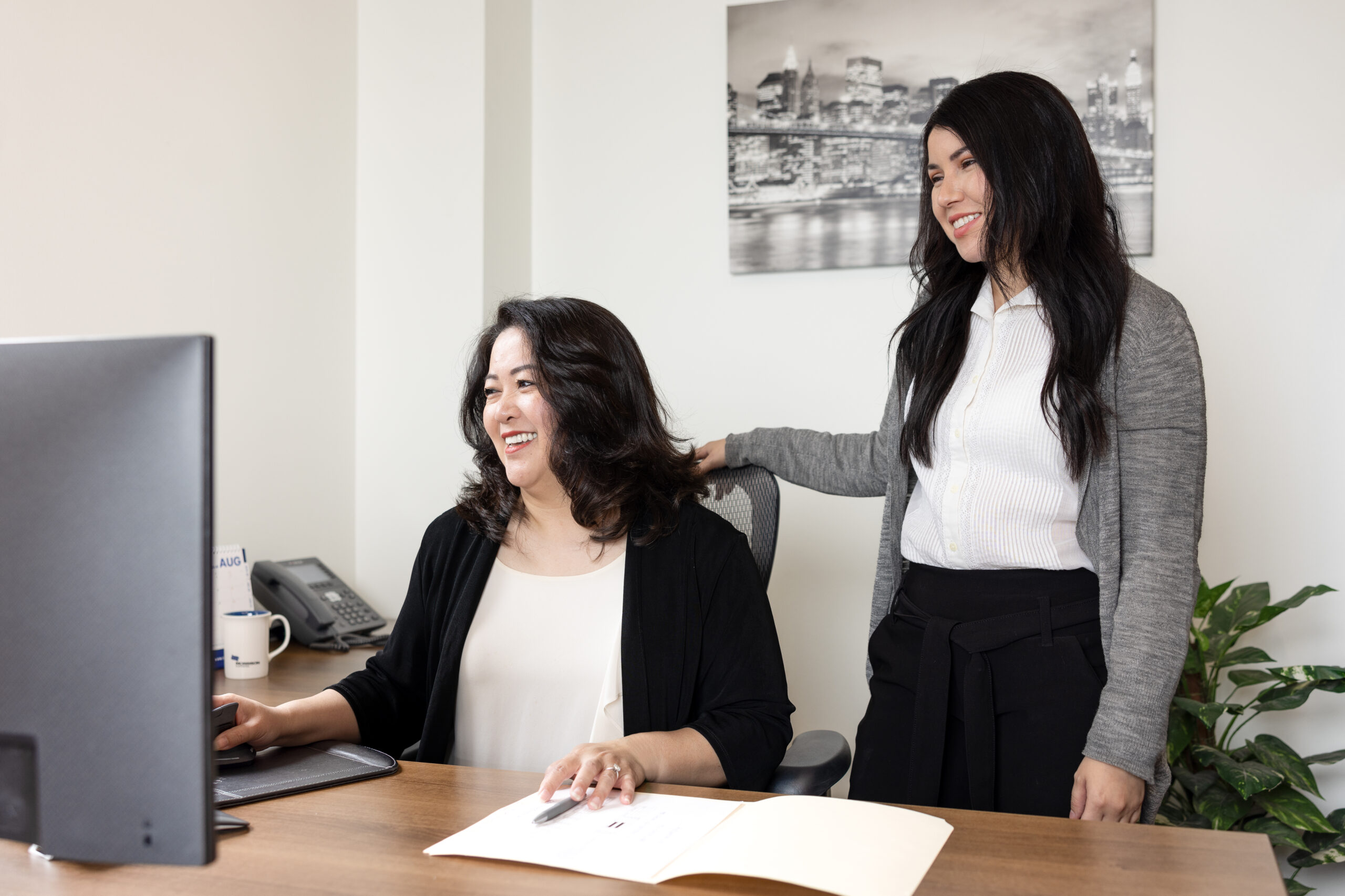 Two Morrison employees in discussion, showing teamwork and shared professional growth.