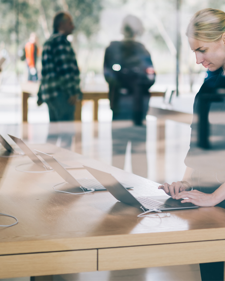 A customer testing a laptop in a retail store. 