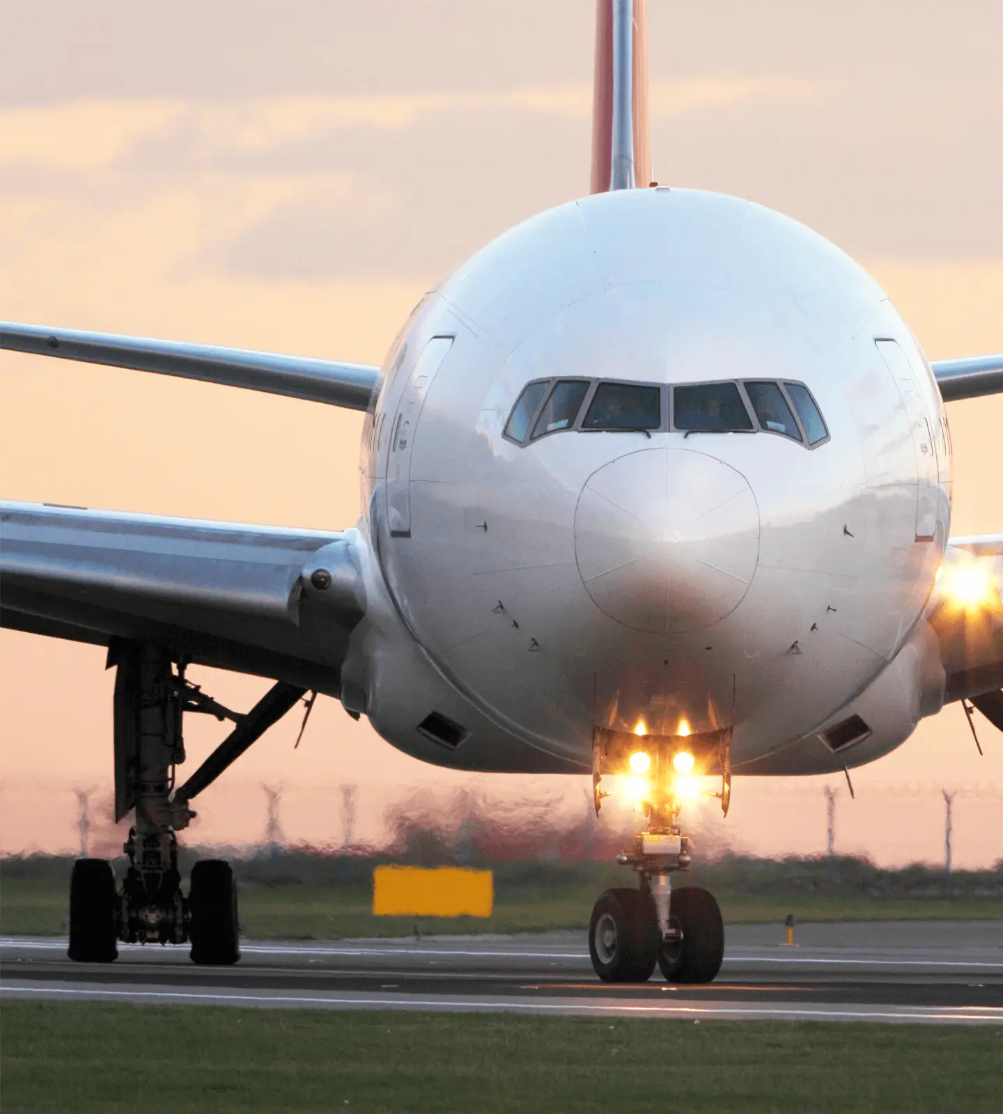 Boeing 777-300 aircraft on airport runway. 