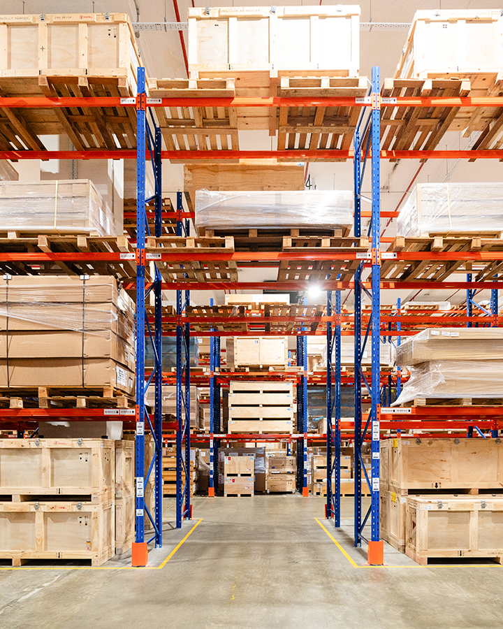 A Morrison warehouse filled with cargo on pallets for storage management.